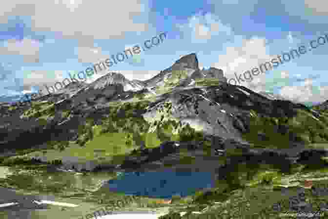 A Hiker Traverses A Narrow Ridge With Garibaldi Lake And Black Tusk In The Background In Garibaldi Provincial Park, British Columbia Destination Hikes: In And Around Southwestern British Columbia